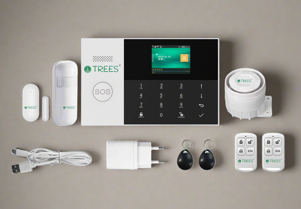 Set of TREES home security system components on a beige background